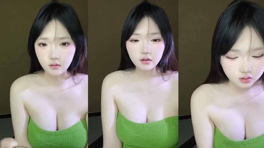Beautiful Korean girl with fair skin and big breasts doing a live stream